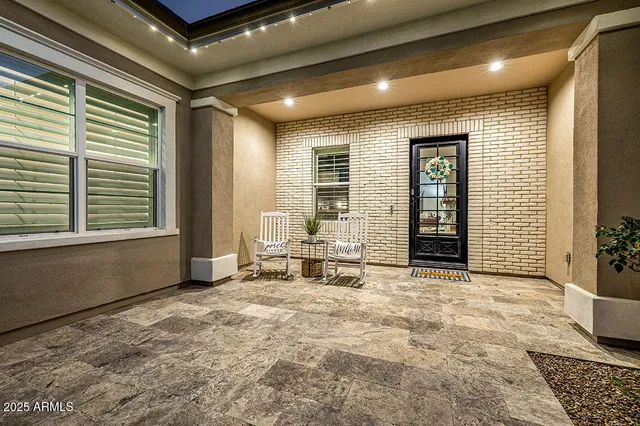 a view of swimming pool with outdoor seating