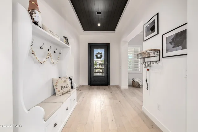 a hallway with furniture and stairs
