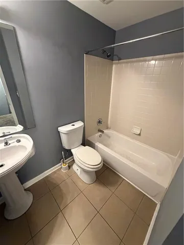 a bathroom with a toilet and a sink