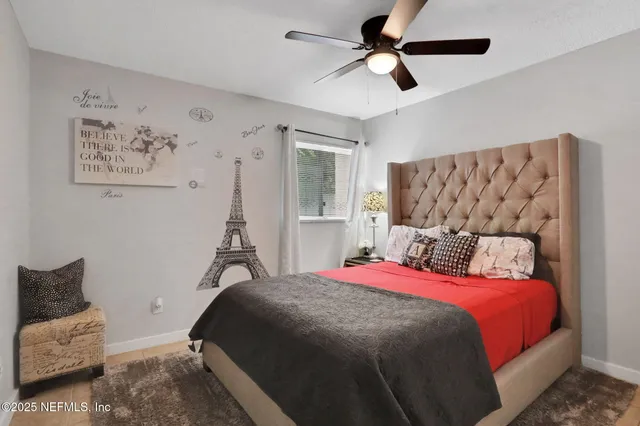 a bedroom with a large bed and a couch