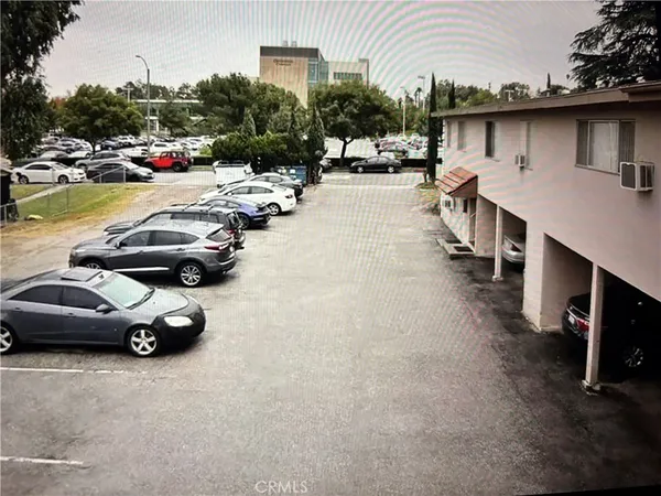 a view of a street with cars