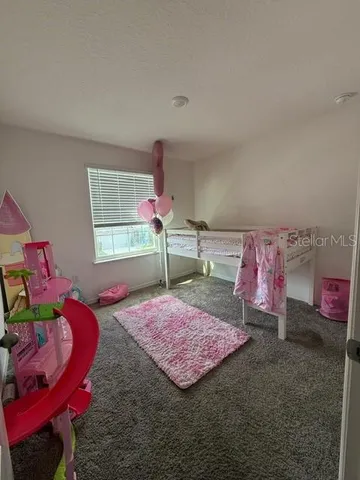 a bedroom with furniture and a bed