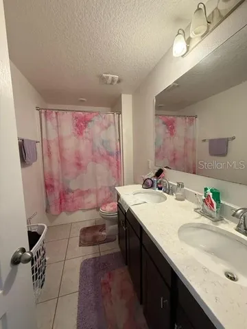 a bathroom with a sink a vanity and a mirror