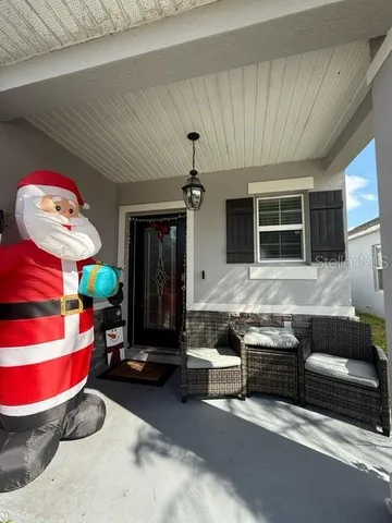 a living room with furniture and flat screen tv