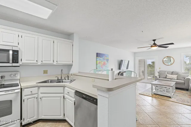 a kitchen with table and chairs