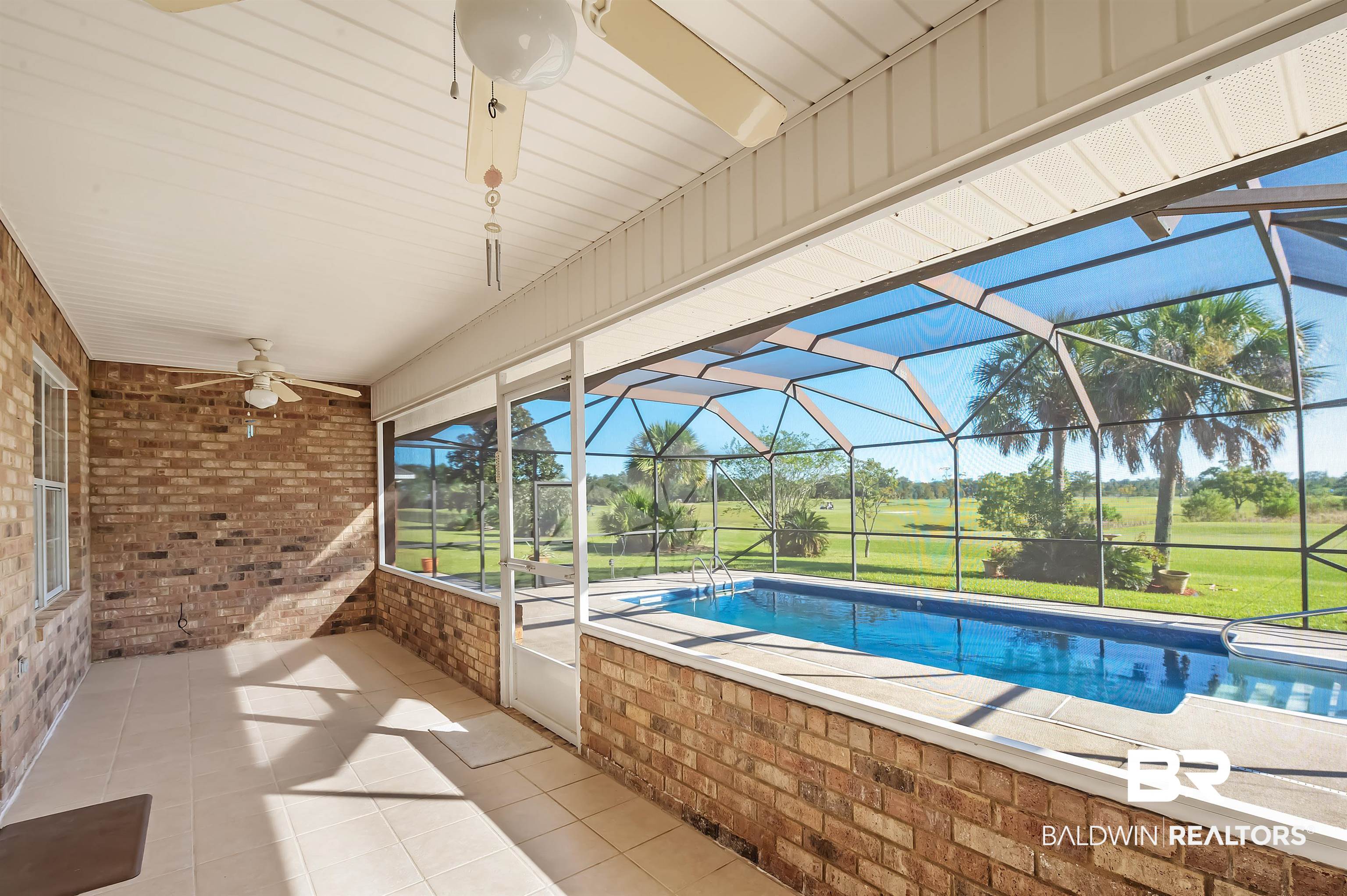 421 Collinwood Loop Foley, AL 36535 - Photo 11 of 62 View of pool with a lawn, a patio area, glass enclosure, and ceiling fan