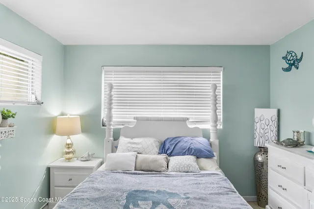 a bedroom with furniture and a window