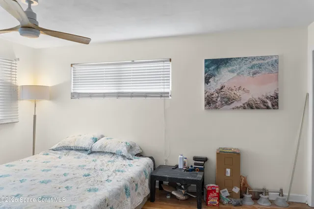 a bedroom with a bed and a baby bed