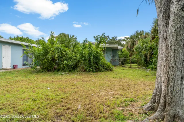 a house with trees in front of it