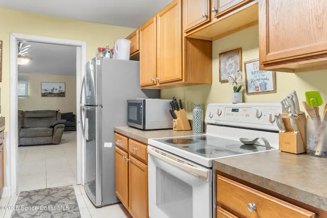 a kitchen with a sink and a refrigerator