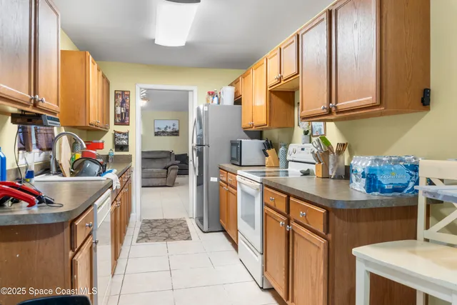 a kitchen with stainless steel appliances granite countertop a sink and cabinets