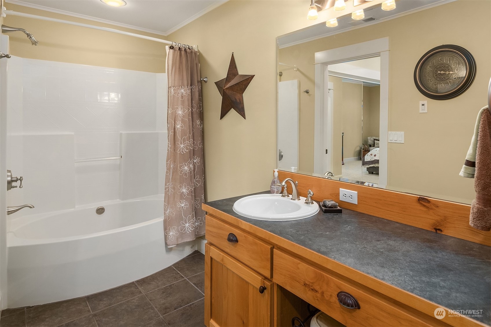28831 Southeast 262nd Street Ravensdale, WA 98051 - Photo 26 of 40 a bathroom with a tub a sink and a mirror