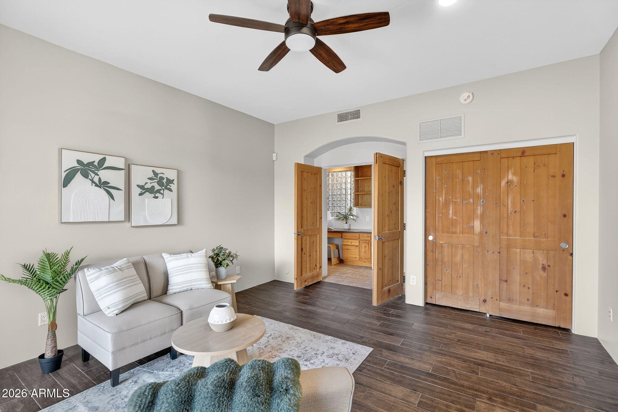 8540 East McDowell Road, Unit 110 Mesa, AZ 85207 - Photo 18 of 74 a living room with furniture and window with wooden floor