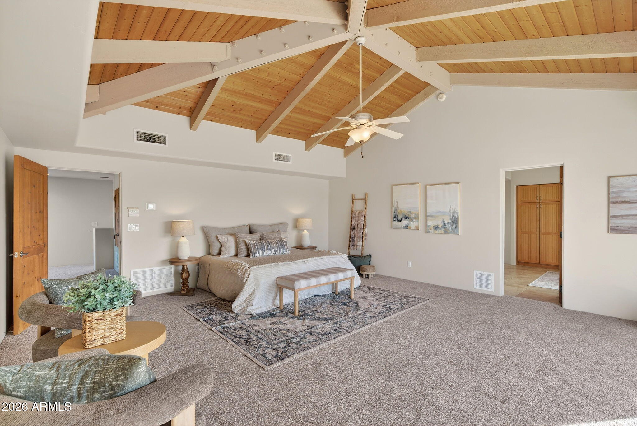 8540 East McDowell Road, Unit 110 Mesa, AZ 85207 - Photo 21 of 74 a room with a bed and a ceiling fan