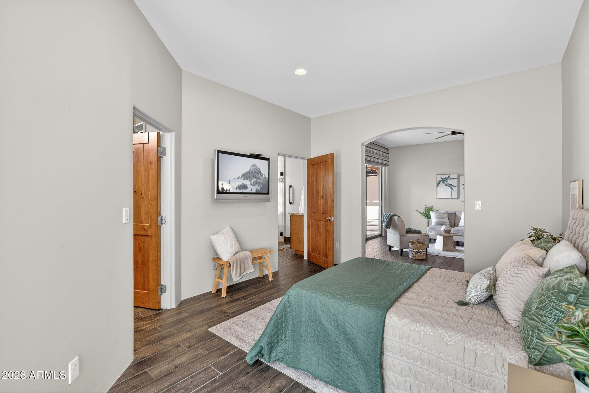 8540 East McDowell Road, Unit 110 Mesa, AZ 85207 - Photo 29 of 74 a bedroom with a bed and wooden floor