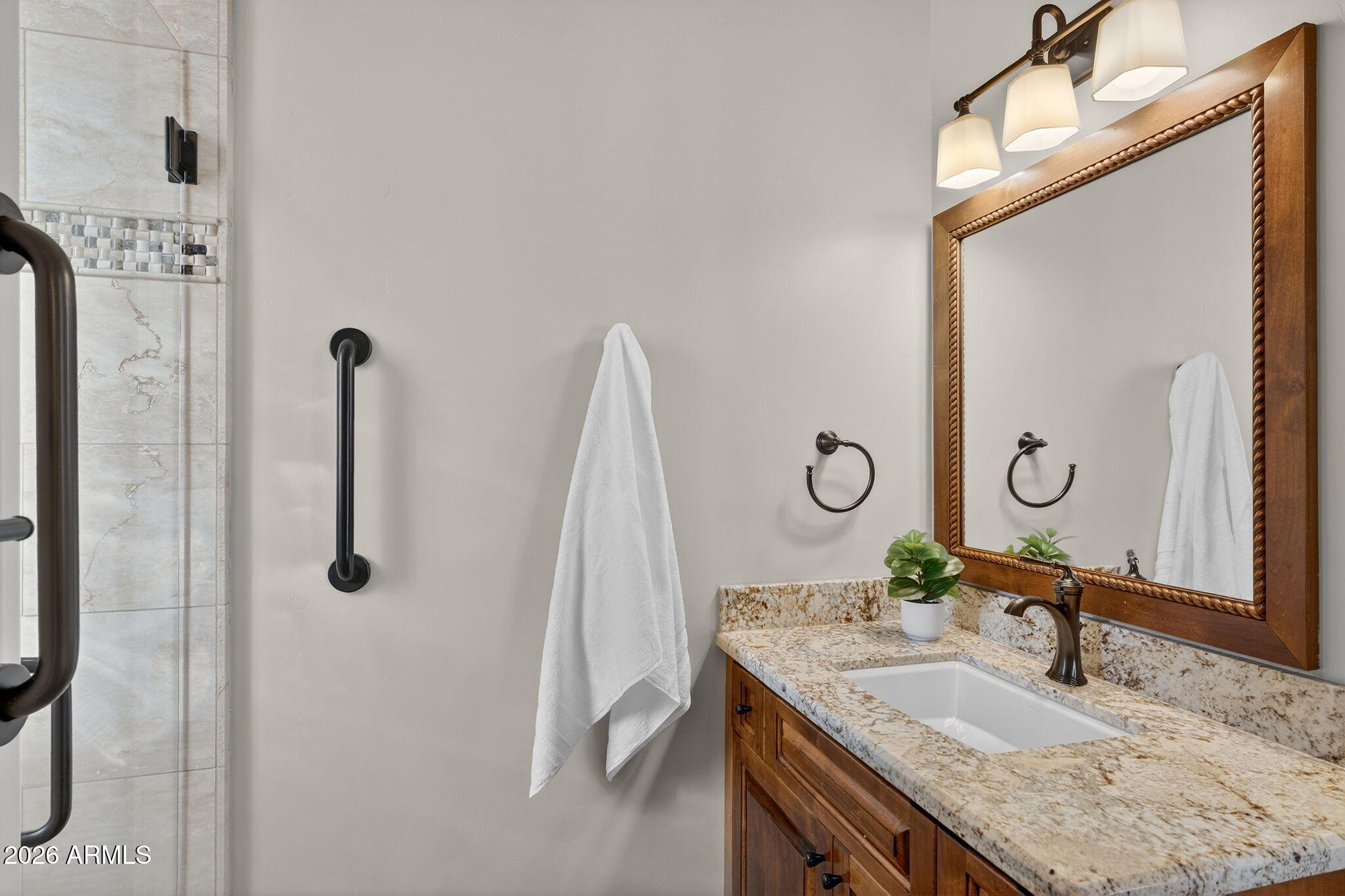 8540 East McDowell Road, Unit 110 Mesa, AZ 85207 - Photo 34 of 74 a bathroom with a granite countertop sink and a mirror