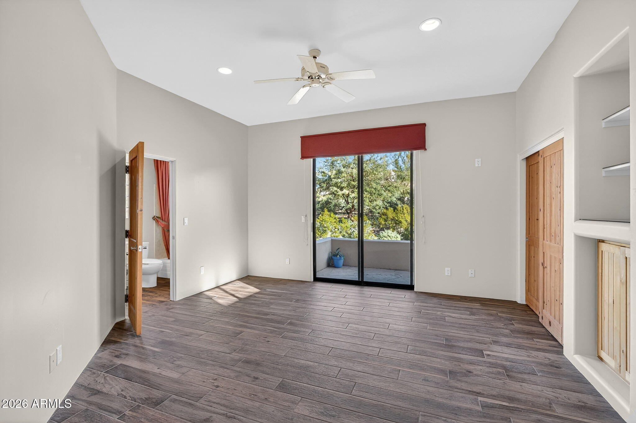 8540 East McDowell Road, Unit 110 Mesa, AZ 85207 - Photo 35 of 74 wooden floor in an empty room with a window