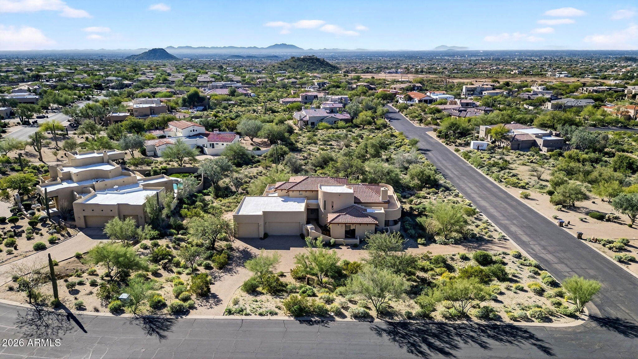 8540 East McDowell Road, Unit 110 Mesa, AZ 85207 - Photo 56 of 74 an aerial view of residential houses with outdoor space