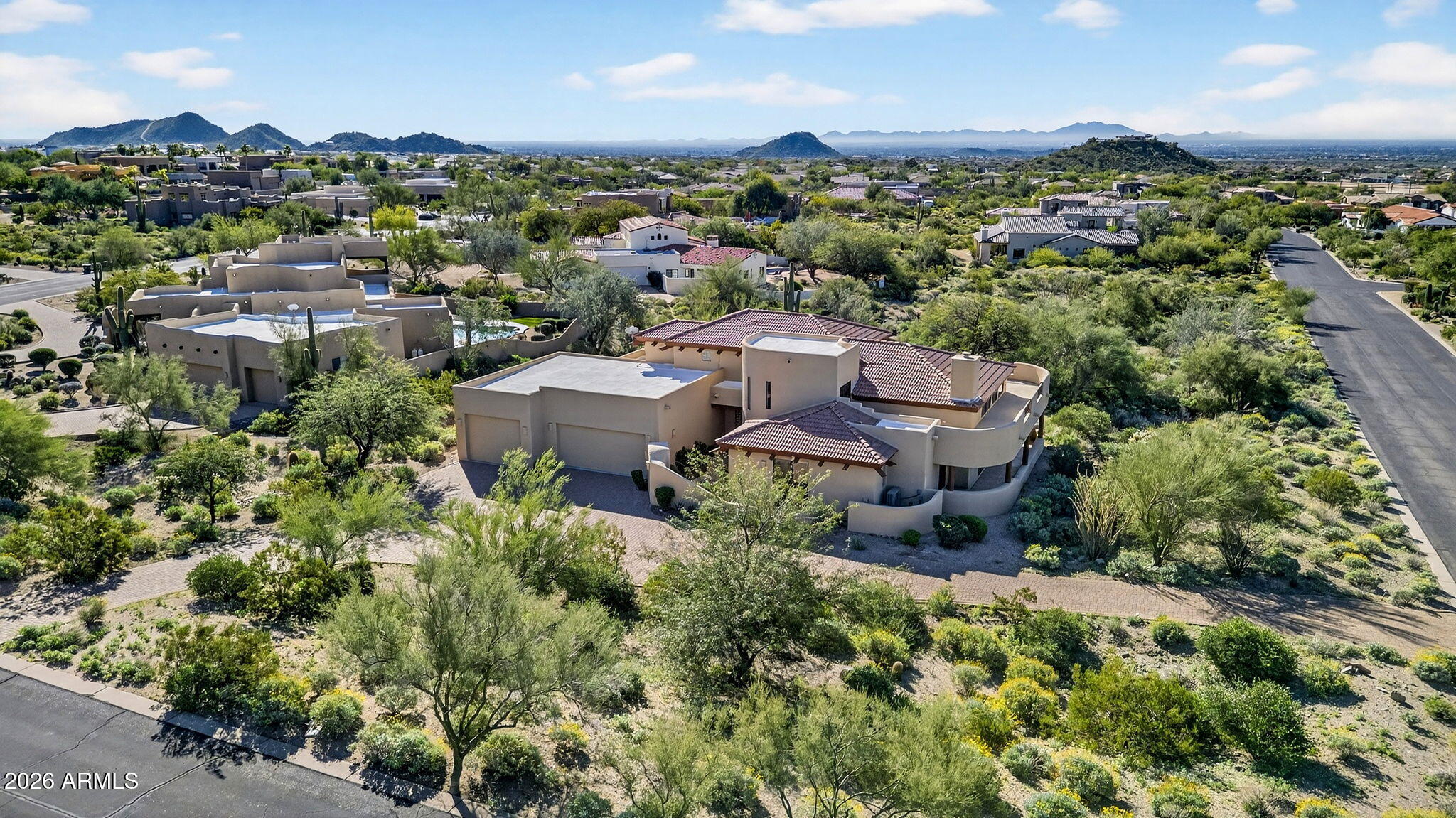 8540 East McDowell Road, Unit 110 Mesa, AZ 85207 - Photo 58 of 74 an aerial view of a city with lots of residential buildings