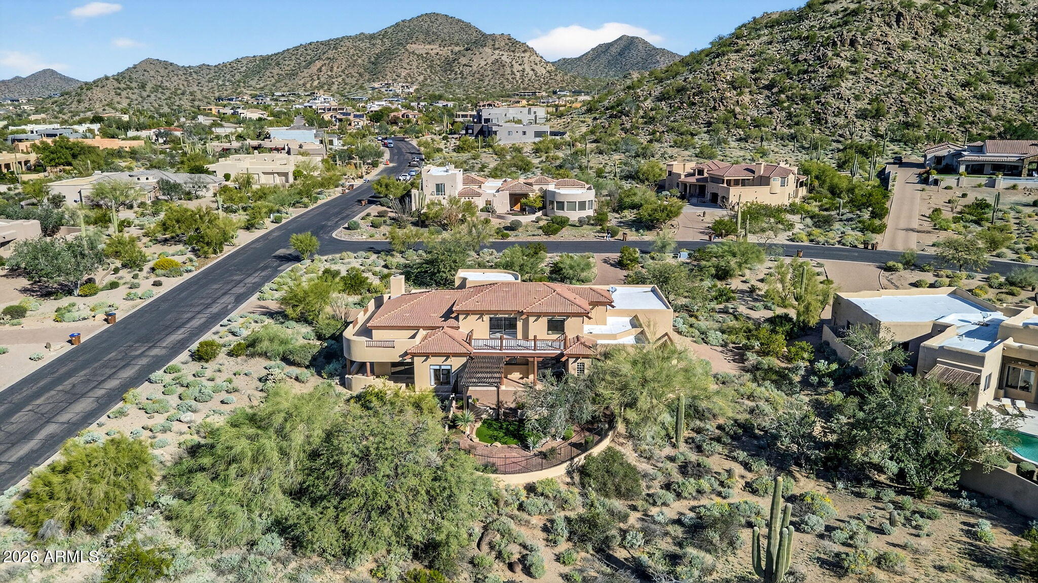 8540 East McDowell Road, Unit 110 Mesa, AZ 85207 - Photo 59 of 74 an aerial view of a house with a garden and trees