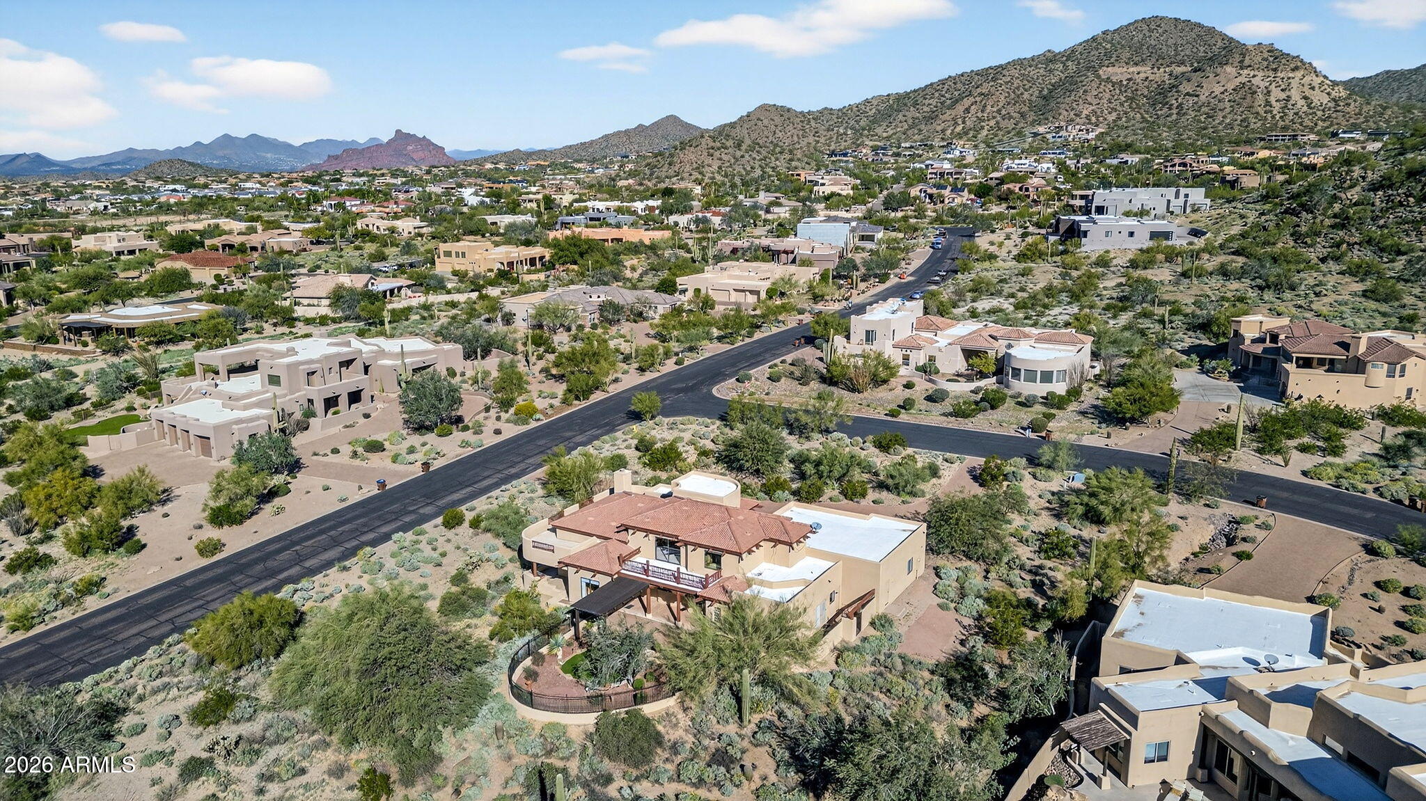 8540 East McDowell Road, Unit 110 Mesa, AZ 85207 - Photo 62 of 74 an aerial view of residential houses with outdoor space