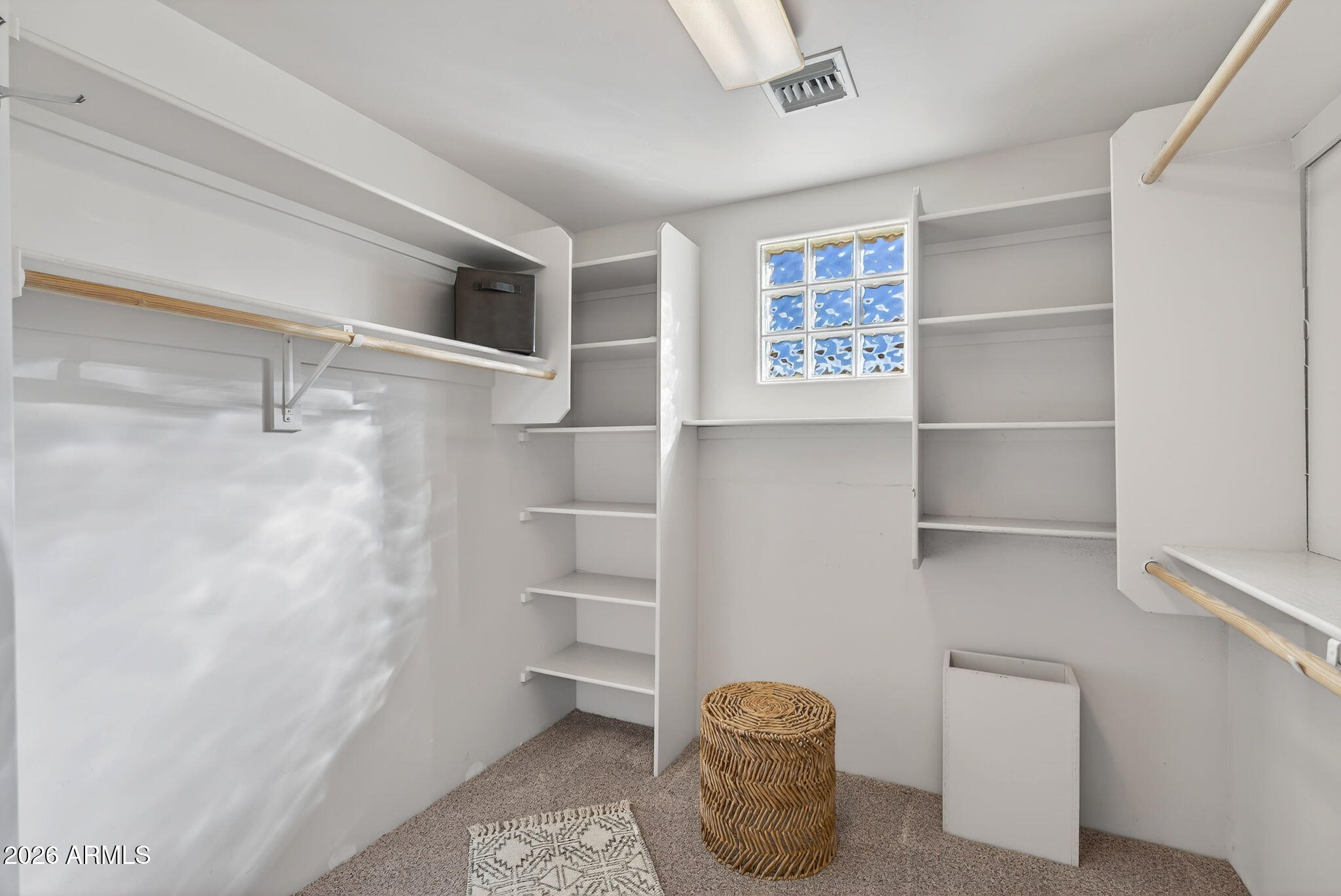 8540 East McDowell Road, Unit 110 Mesa, AZ 85207 - Photo 66 of 74 a view of an empty walk in closet