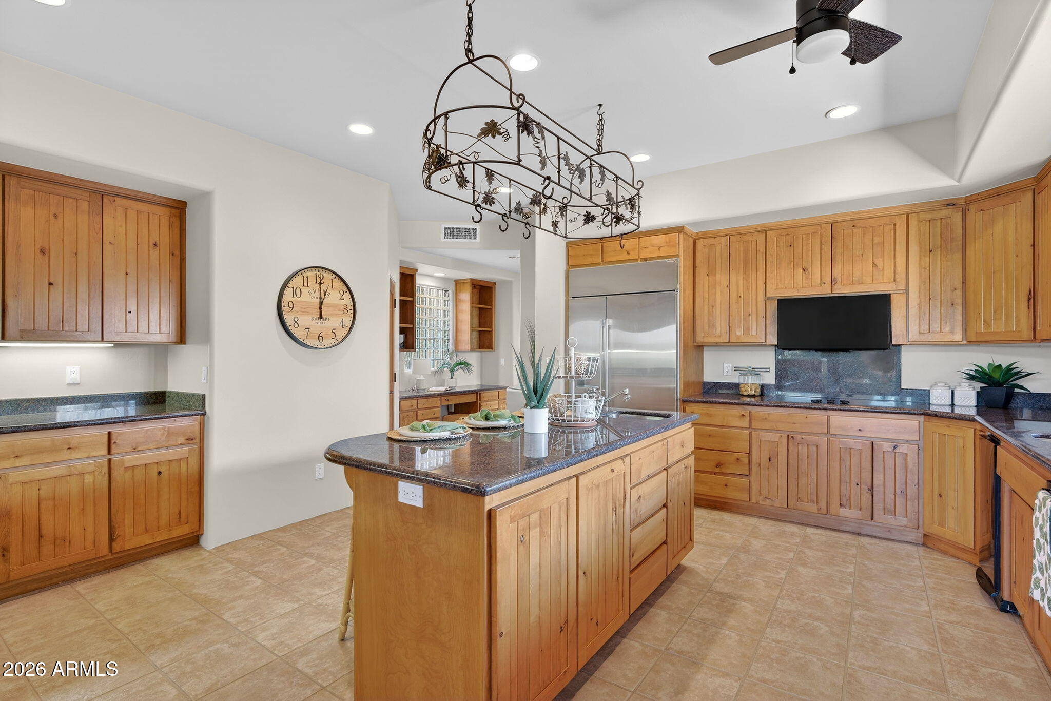 8540 East McDowell Road, Unit 110 Mesa, AZ 85207 - Photo 8 of 74 a kitchen with stainless steel appliances granite countertop a sink dishwasher stove top oven and cabinets