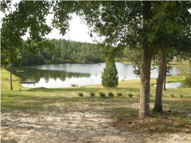 1083 Tallokas Road Crestview, FL 32536 - Photo 3 of 35 a view of a lake from a yard