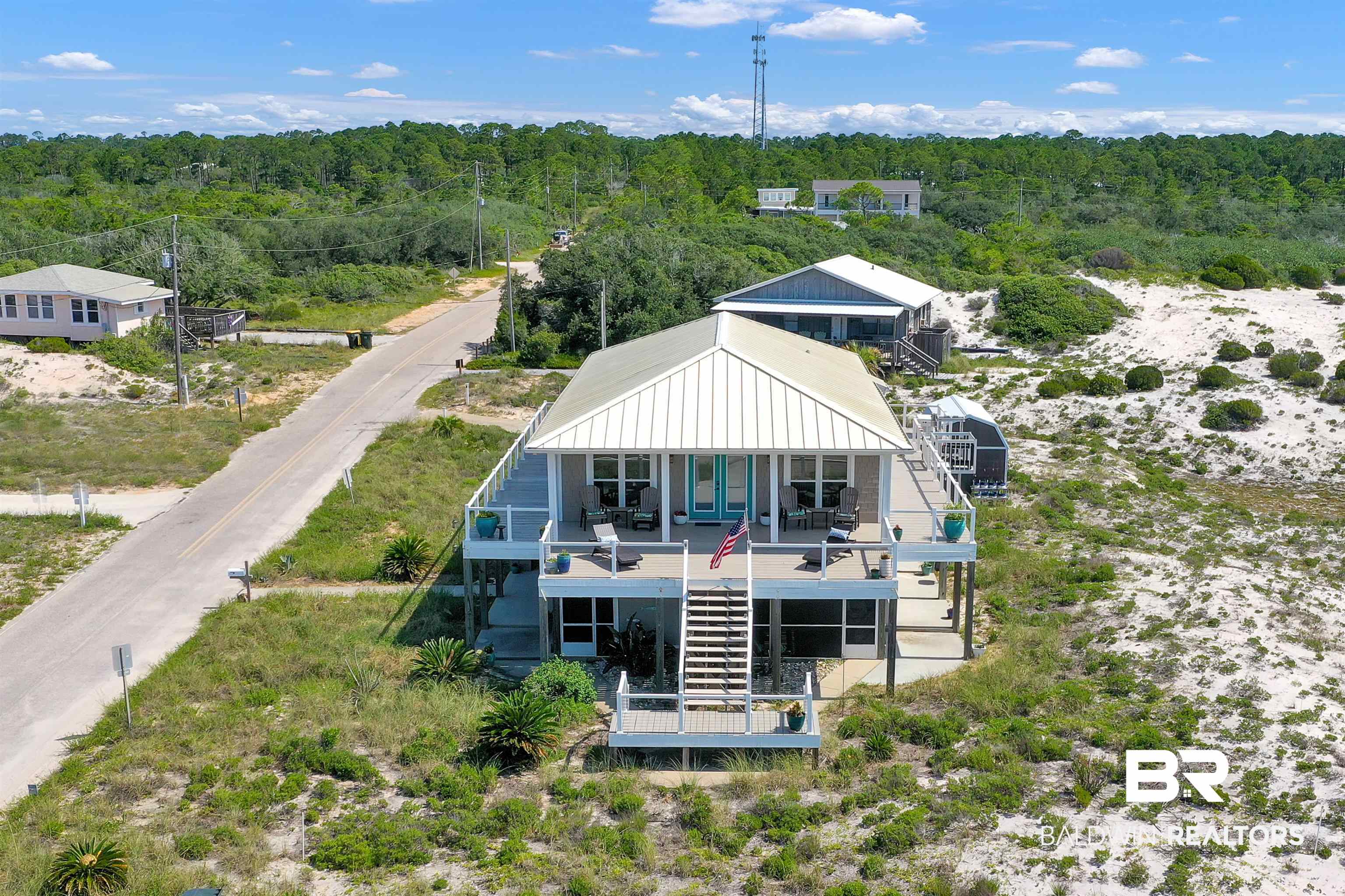 418 Veterans Road Gulf Shores, AL 36542 - Photo 5 of 51 View of subject property with a heavily wooded area