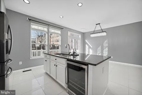 a kitchen with granite countertop a sink and a window