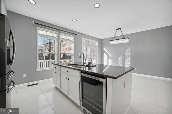 a kitchen with granite countertop a sink and a window