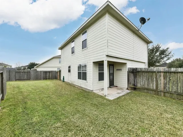 a front view of house with a garden and yard
