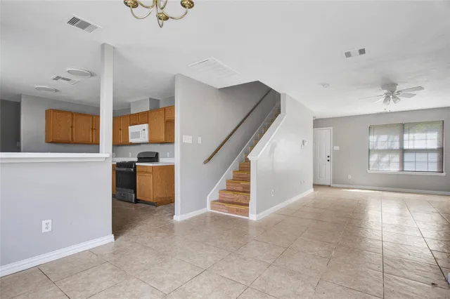 a view of entryway and kitchen