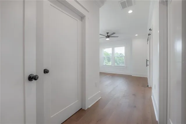 a view of an empty room and a window