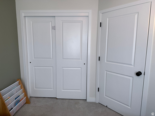 774 West 480 South American Fork, UT 84003 - Photo 61 of 76 Paneled bifold closet doors with a matte black knob, complemented by an interior door with matching hardware