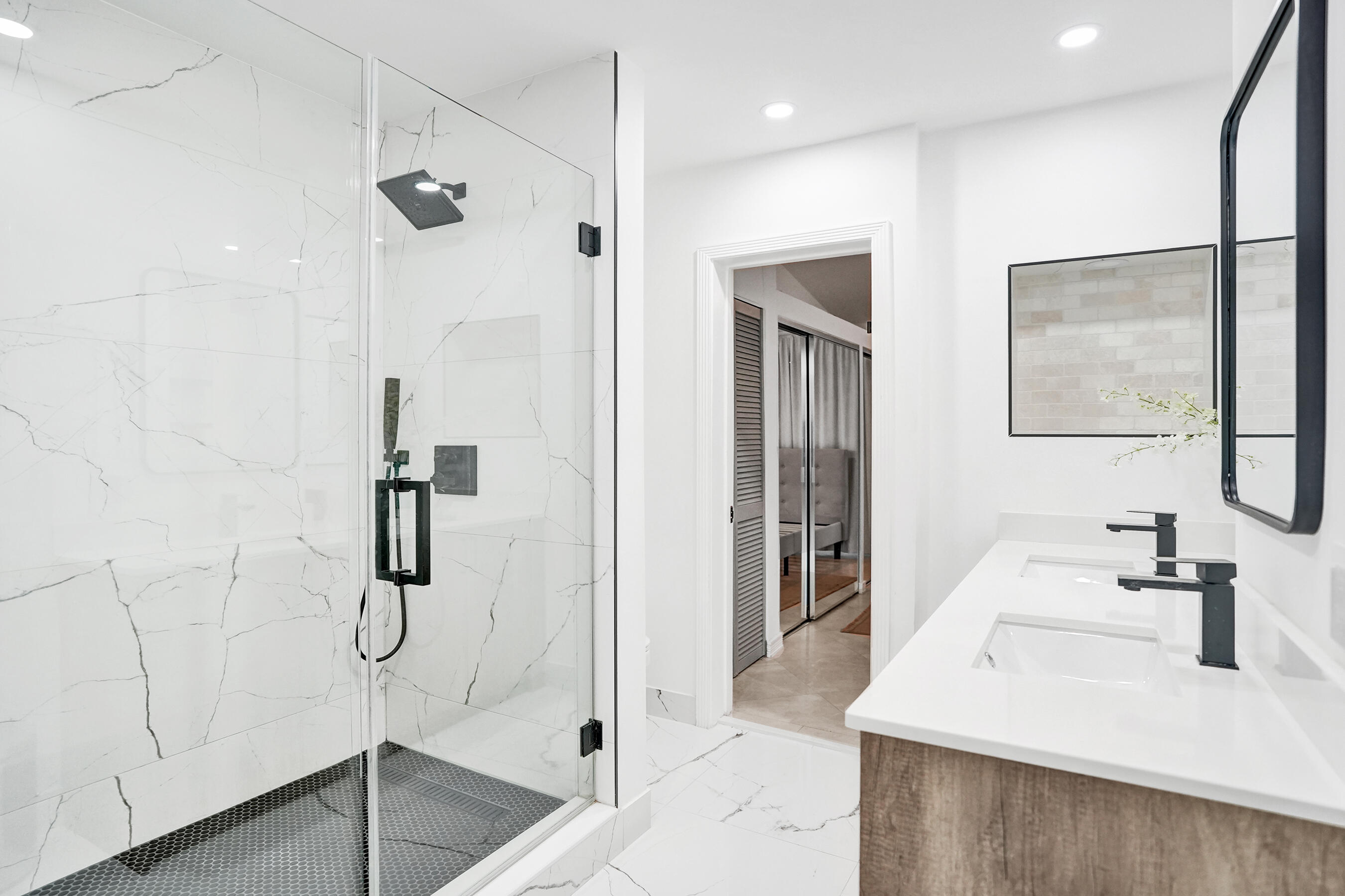 147 Southwest 3rd Street Pompano Beach, FL 33060 - Photo 19 of 29 a bathroom with a sink a shower and a mirror