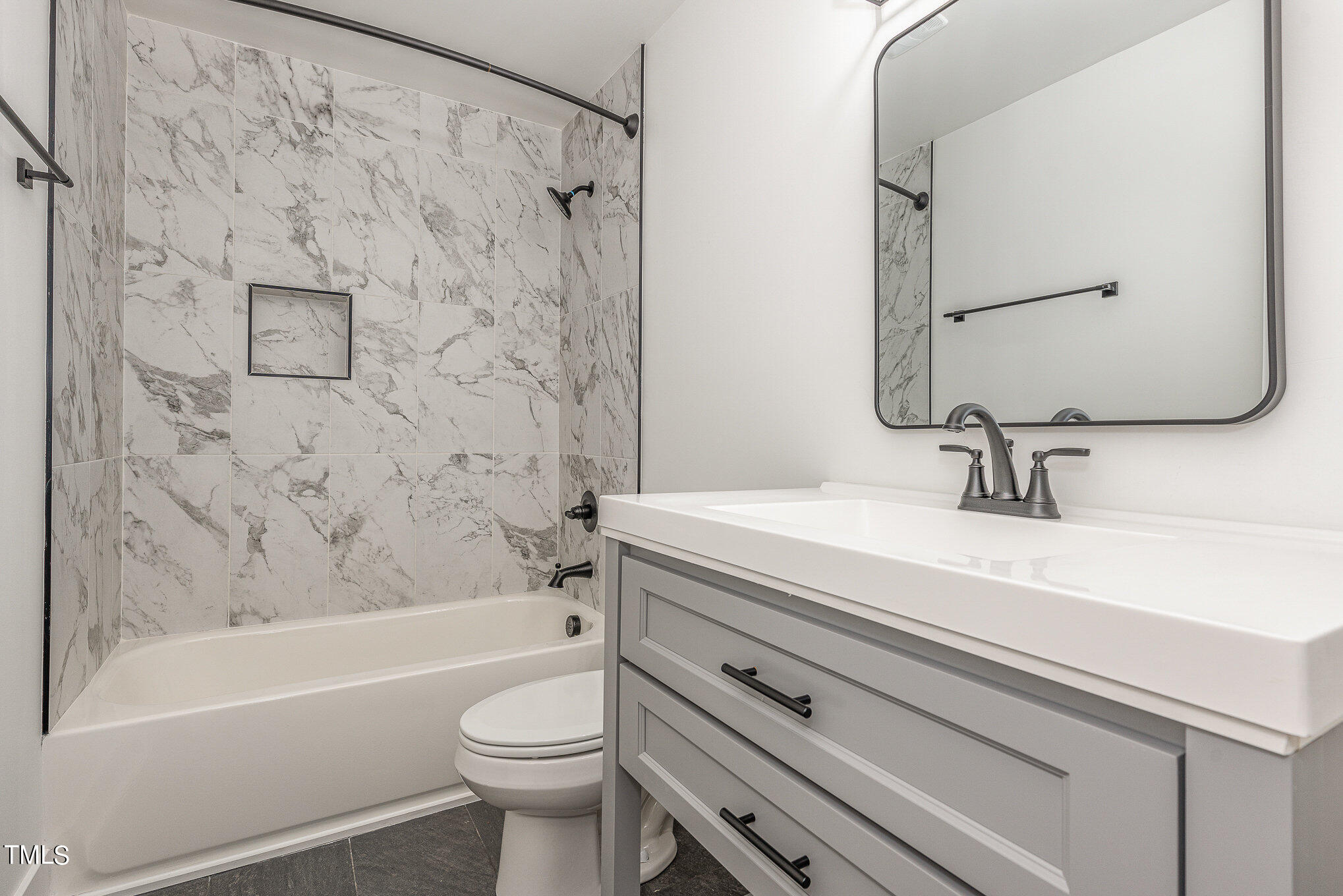 415 Lamont Street Raleigh, NC 27610 - Photo 9 of 13 a bathroom with a sink a toilet and a bathtub
