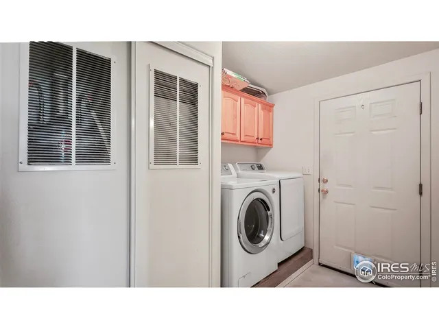 a bathroom with a sink a washer and dryer