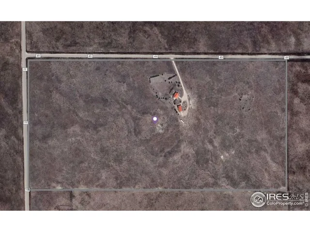 a utility room with a shower and a ceiling fan