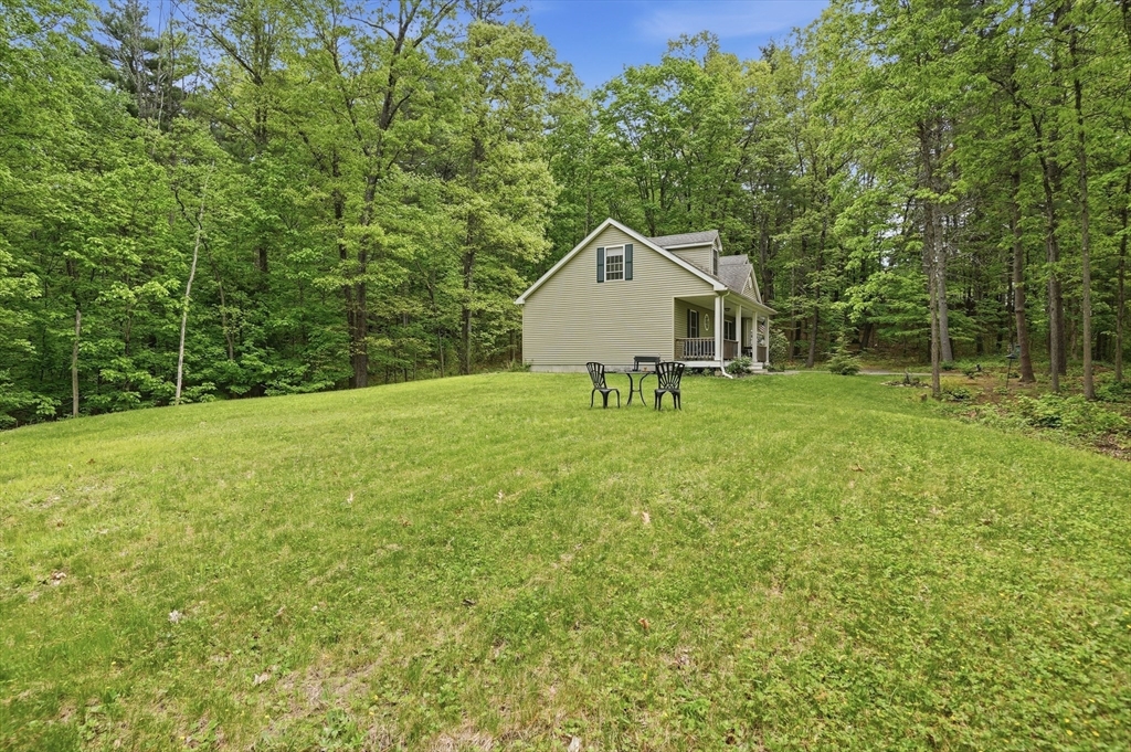 186 Common Street Groton, MA 01450 - Photo 28 of 28 a house with a tree in front of it