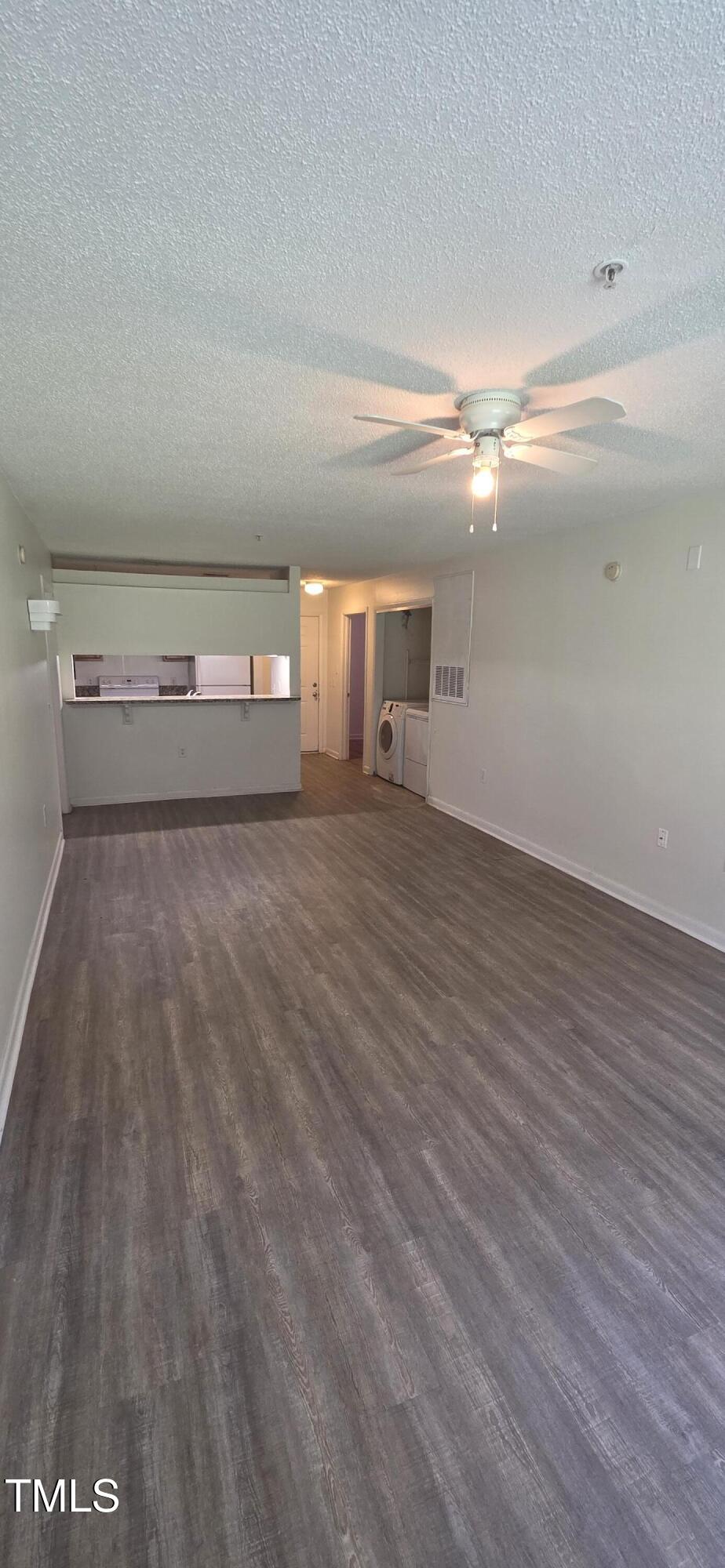 1401 Collegiate Circle, Unit 104 Raleigh, NC 27606 - Photo 12 of 29 a view of a room with wooden floor