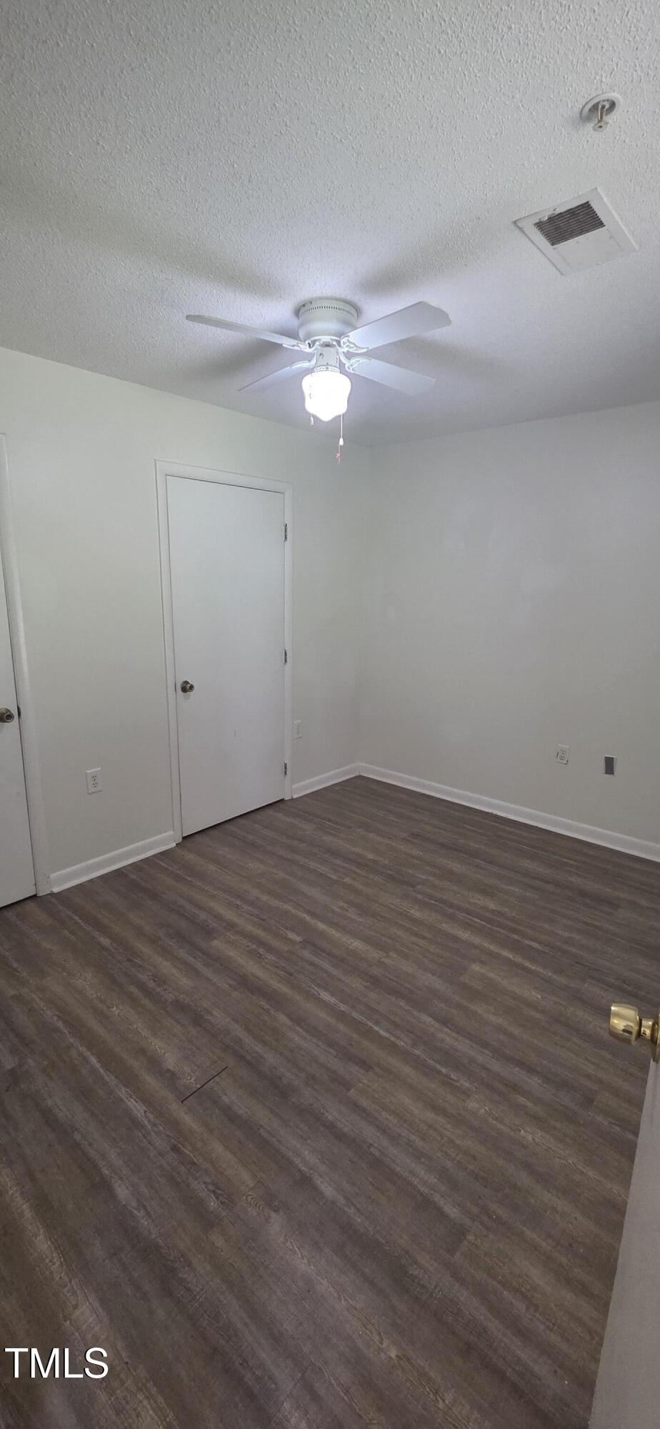 1401 Collegiate Circle, Unit 104 Raleigh, NC 27606 - Photo 21 of 29 wooden floor in an empty room