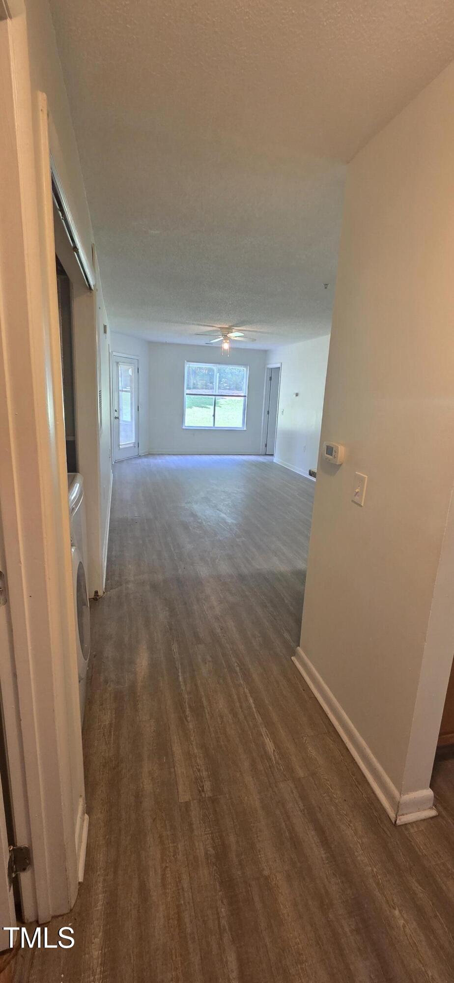 1401 Collegiate Circle, Unit 104 Raleigh, NC 27606 - Photo 4 of 29 a view of a room with wooden floor and window