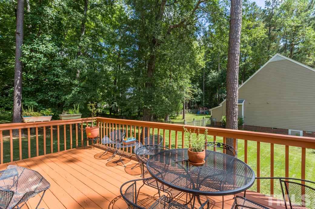 11817 Radner Way Raleigh, NC 27613 - Photo 9 of 15 a view of a balcony with a table and chairs