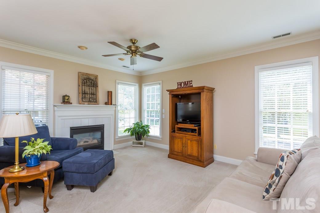 11817 Radner Way Raleigh, NC 27613 - Photo 2 of 15 a living room with furniture and a fireplace
