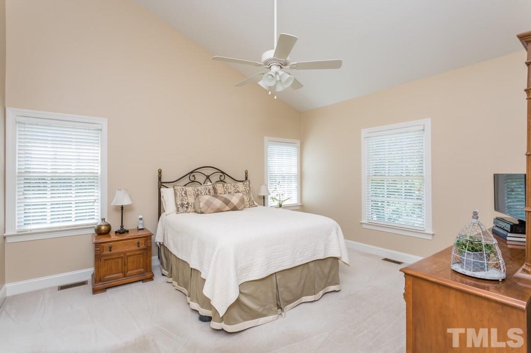 11817 Radner Way Raleigh, NC 27613 - Photo 3 of 15 a bedroom with a bed and a window