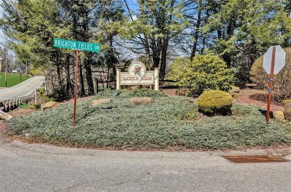 a backyard of a house with lots of green space