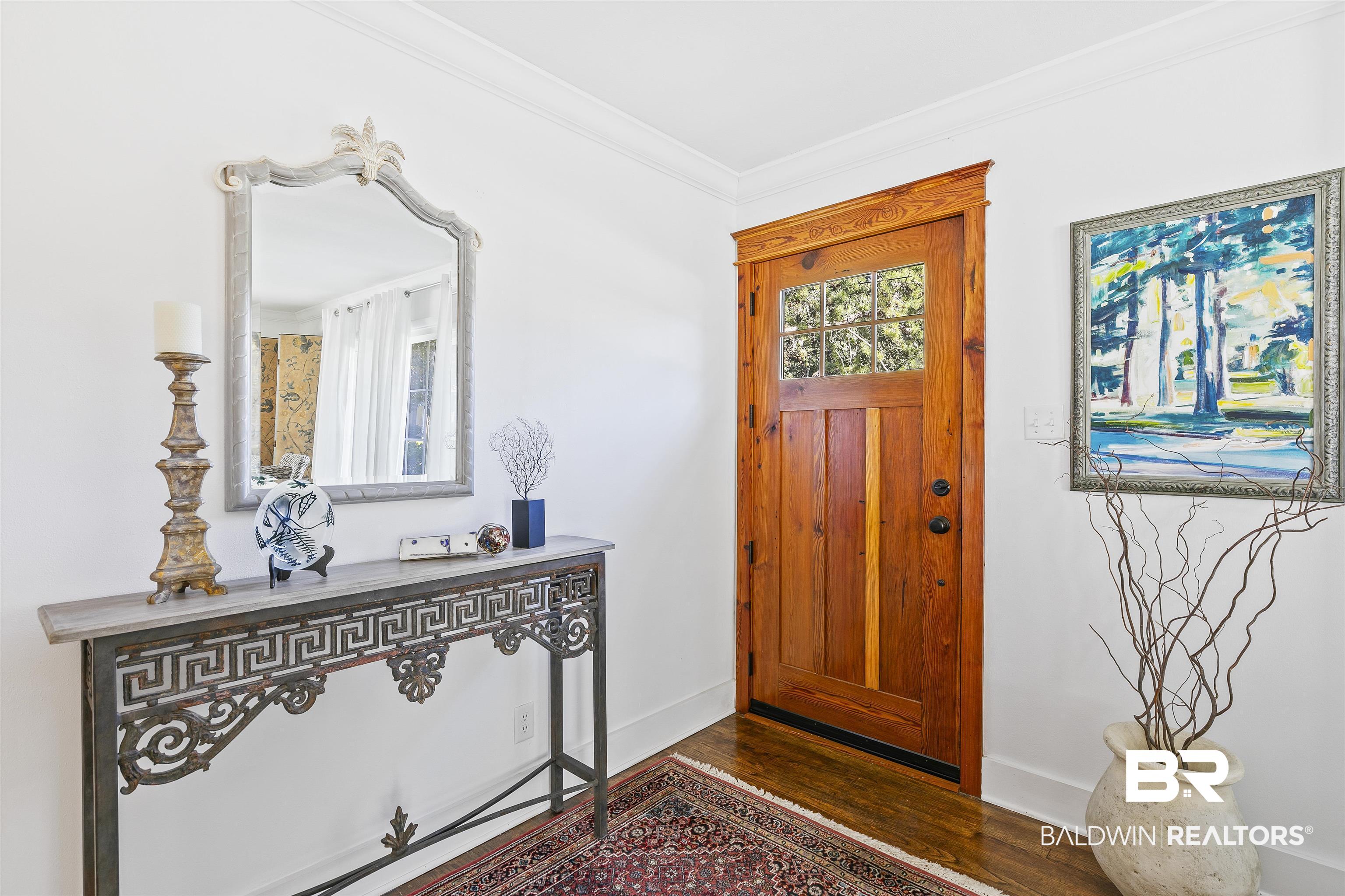220 Pinecrest Lane Fairhope, AL 36532 - Photo 12 of 32 Foyer entrance with ornamental molding and dark wood-type flooring