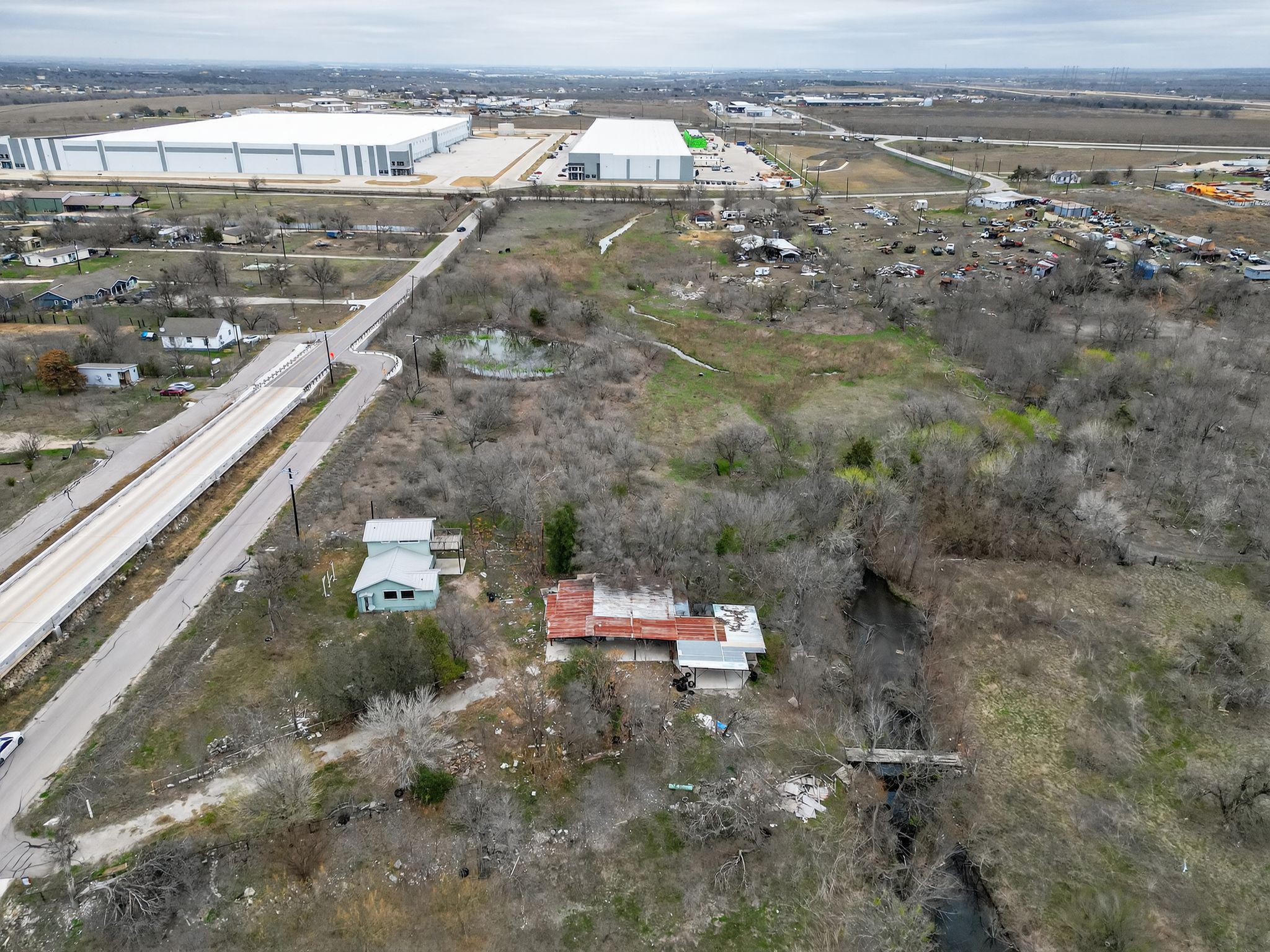 11223 Tom Sassman Road Austin, TX 78747 - Photo 18 of 40 Aerial view of property's location featuring industrial structures