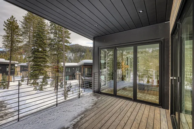 a view of a porch with wooden floor and outdoor space